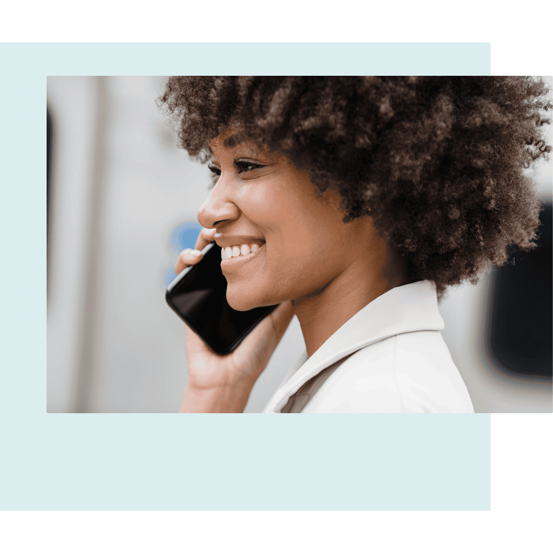 Smiling woman talking on phone, professional attire